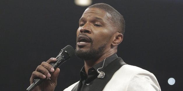 Actor Jamie Foxx sings the national anthem before the start of the world welterweight championship bout between Floyd Mayweather Jr., and Manny Pacquiao, on Saturday, May 2, 2015 in Las Vegas. (AP Photo/Isaac Brekken)