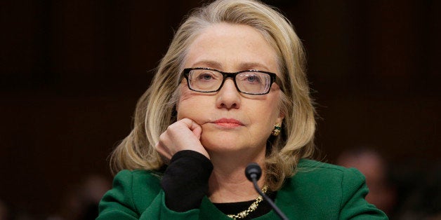 Secretary of State Hillary Rodham listens as she testifies on Capitol Hill in Washington, Wednesday, Jan. 23, 2013, before the Senate Foreign Relations Committee hearing on the deadly September attack on the U.S. diplomatic mission in Benghazi, Libya, that killed Ambassador Chris Stevens and three other Americans. (AP Photo/J. Scott Applewhite)