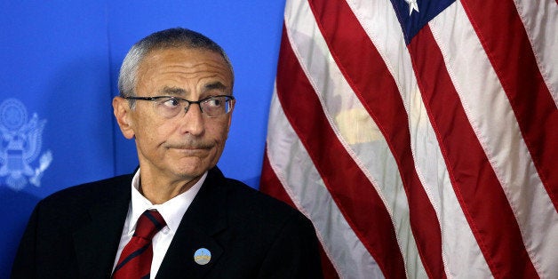 Counselor to U.S. president John D. Podesta listens during a news conference at the U.S. embassy in Kabul, Afghanistan, Monday, Sept. 29, 2014. A senior adviser to U.S. President Barack Obama said Monday that Afghanistan will sign a deal Tuesday to allow American soldiers to remain in the country past the end of the year. (AP Photo/Massoud Hossaini)