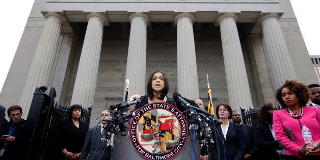 FILE - In this Friday, May 1, 2015 file photo, Marilyn Mosby, Baltimore's top prosecutor, speaks during a news conference in Baltimore. Mosby charged six officers in the death of Freddie Gray, who suffered a grave spinal injury as he was arrested and put into a police transport van, handcuffed and without a seat belt. But getting a jury to convict police officers of murder and manslaughter will be far harder than obtaining arrest warrants. (AP Photo/Alex Brandon)