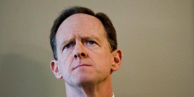 Sen. Pat Toomey, R-Pa.,, listens during a news conference Monday, Feb. 10, 2014, at a Fraternal Order of Police lodge in Philadelphia. The news conference was held to express opposition to President Barack Obama's nomination of lawyer Debo Adegbile to serve as the U.S. Department of Justice's assistant attorney general for civil rights. Adegbile had done worked with the NAACP on behalf of convicted Philadelphia cop-killer Mumia Abu-Jama. (AP Photo/Matt Rourke)