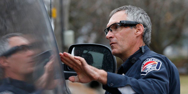 WEST VALLEY CITY, UT - MARCH 2: West Valley City patrol officer Gatrell performs a traffic stop on the first day of use of his newly-issued body camera attached to the side of a pair of glasses on March 2, 2015 in West Valley City, Utah. West Valley City Police Department has issued 190 Taser Axon Flex body cameras for all it's sworn officers to wear starting today. (Photo by George Frey/Getty Images)