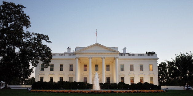 A October 20, 2013 photo shows the White House as seen from Pennsylvania Avenue as the sun sets on October 20, 2013 in Washington, DC. AFP PHOTO/Mandel NGAN (Photo credit should read MANDEL NGAN/AFP/Getty Images)