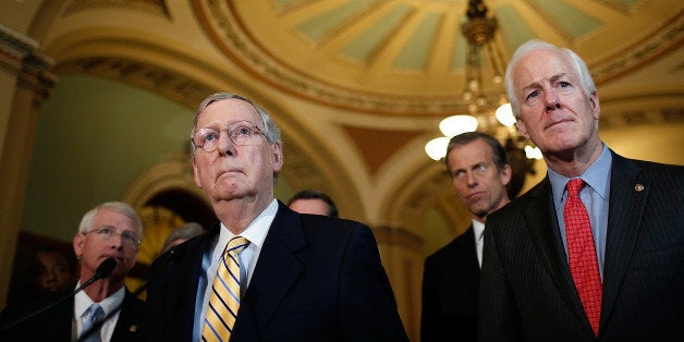 WASHINGTON, DC - APRIL 21: Sen. Majority Leader Mitch McConnell (2nd L) (R-KY) takes questions from the media following the Senate policy luncheons at the U.S. Capitol April 21, 2015 in Washington, DC. Leaders from both parties have agreed to a compromise on a human trafficking bill, and will move to a vote on Attorney General nominee Loretta Lynch soon. Also pictured are Sen. Roger Wicker (L) (R-MS), Sen. John Cornyn (R) (R-TX) and Sen. John Thune (2nd R) (R-SD). (Photo by Win McNamee/Getty Images)