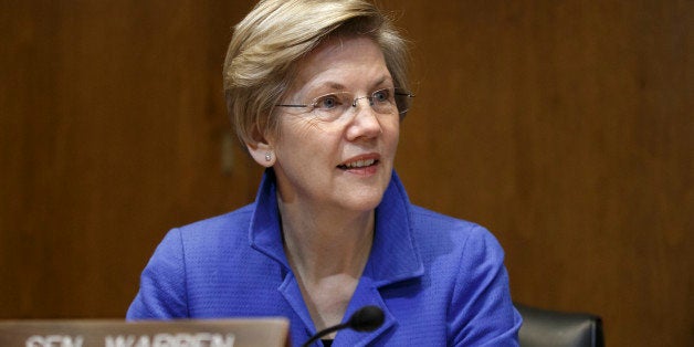 Senate Energy and Natural Resources Committee member Sen. Elizabeth Warren, D-Mass. listens as the committee works on a bill to approve the long-stalled Keystone XL pipeline that fell short of passage in December when Democrats ruled the Senate, Thursday, Jan. 8, 2015, on Capitol Hill in Washington. (AP Photo/J. Scott Applewhite)