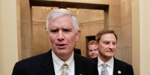 FILE - This July 28, 2011 file photo shows Rep. Mo Brooks, R-Ala., left, on Capitol Hill in Washington. The tea party may have learned its lesson. As Congress finishes work on a must-pass spending bill set for votes next week, the most conservative lawmakers on Capitol Hill are eager to send a message on immigration, and stand firm against a government lending bank. But a year after they forced a 16-day partial government shutdown over President Barack Obamaâs health care law, few seem to have the stomach to push their demands that far again. "No question we learned that with the aid of the news media the Democrats were able to pin the blame on us" for last yearâs shutdown, said Brooks. (AP Photo/J. Scott Applewhite, File)