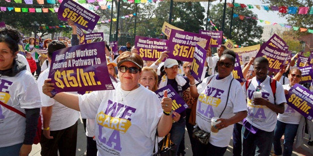 Home health care workers rally for better wages at Olvera Street, Tuesday, April 14, 2015, in Los Angeles. The union represen