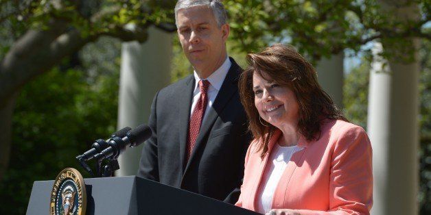 The 2015 National Teacher of the Year, Texas high school English teacher Shanna Peeples (C), speaks watch by Education Secretary Arne Duncan (L), during a ceremony honouring the 2015 National Teacher of the Year on April 29, 2015 in the Rose Garden of the White House in Washingon, DC. AFP PHOTO/MANDEL NGAN (Photo credit should read MANDEL NGAN/AFP/Getty Images)