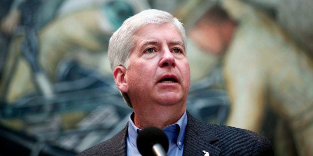 DETROIT, MI - JUNE 9: Michigan Gov. Rick Snyder speaks at a press conference at the Detroit Institute of Arts June 9, 2014 in Detroit, Michigan. Snyder and others announced that Ford Motor Company, General Motors, and Chrysler Group were contributing $26 million to a grand bargain fund to help the DIA reach it's $100 million share of the grand bargain fund to help protect its artworks from being sold due to the City of Detroit's bankruptcy. (Photo by Bill Pugliano/Getty Images)