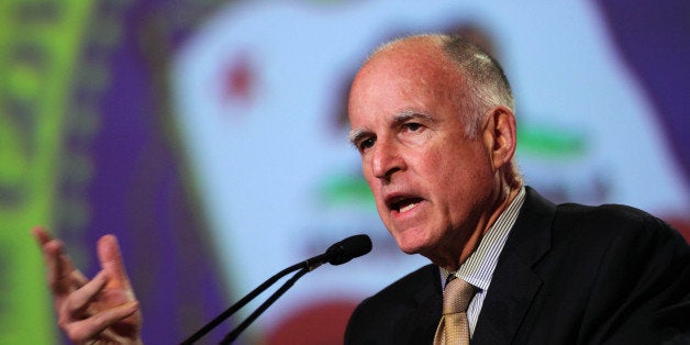 FILE - In this May 22, 2012 file photo, Gov. Jerry Brown discusses his proposed tax initiative, Proposition 30, during his appearance at the 87th Annual Sacramento Host Breakfast in Sacramento, Calif. The passage of Proposition 30 and the changes he pushed to public pension system through the Legislature were among Brown's goals for 2012. The passage of Proposition 30 was among his goals for 2012. At the halfway mark of his four-year term, Brown looks to pursue legacy-building achievements such as the construction of a water infrastructure project for the Sacramento-San Joaquin Delta and the nation's first high-speed rail system. (AP Photo/Rich Pedroncelli, File)