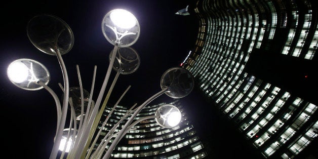 The UniCredit headquarters building towers over Milan's business center, Italy, Tuesday, Nov. 11 , 2014. The recent Europe-wi
