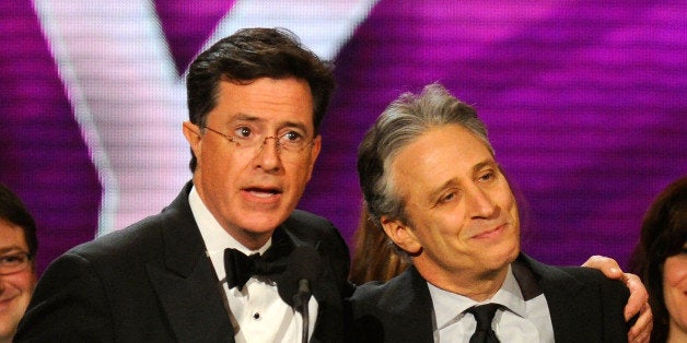 NEW YORK, NY - MARCH 26: Stephen Colbert and Jon Stewart speak onstage at the First Annual Comedy Awards at Hammerstein Ball