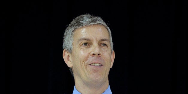 This photo taken Nov. 7, 2013 shows Education Secretary Arne Duncan speaking Malcolm X Elementary School in Washington. Dunca