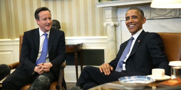 WASHINGTON, DC - JANUARY 16: U.S. President Barack Obama (R) meets with British Prime Minister David Cameron (L) at the Oval Office of the White House January 16, 2015 in Washington, DC. The two leaders were expected to discuss bilateral issues including economic growth, international trade, cybersecurity, Iran, ISIL, counterterrorism, Ebola, and Russias actions in Ukraine. (Photo by Alex Wong/Getty Images)