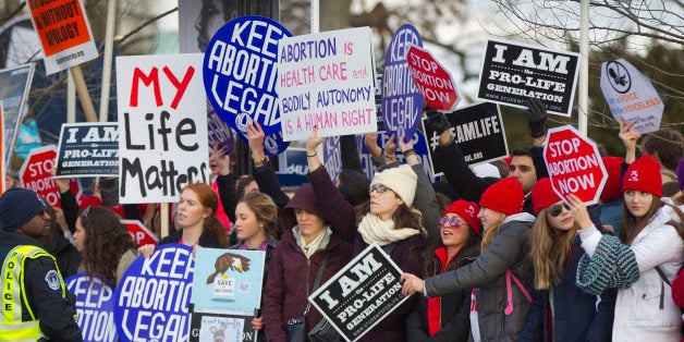 Anti-abortion demonstrators converge in front of the Supreme Court in Washington, Thursday, Jan. 22, 2015, during the annual March for Life. Thousands of anti-abortion demonstrators gathered in Washington for an annual march to protest the Supreme Court's landmark 1973 decision that declared a constitutional right to abortion. (AP Photo/Pablo Martinez Monsivais)