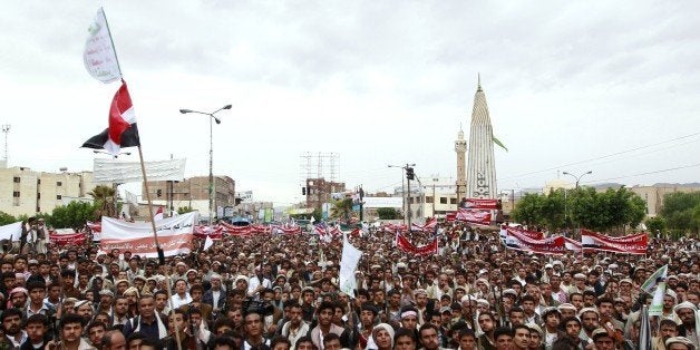 Supporters of the Shiite Huthi movement brandish their weapons during a demonstration against the Saudi-led air strikes, in the capital Sanaa, on May 8, 2015. Saudi Arabia's foreign minister announced a humanitarian ceasefire in the Yemen conflict to start on May 12 for five days, and is subject to renewal. AFP PHOTO / MOHAMMED HUWAIS (Photo credit should read MOHAMMED HUWAIS/AFP/Getty Images)