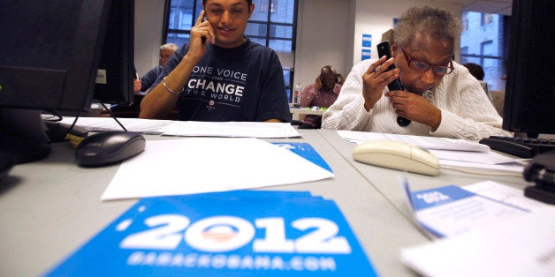 Volunteers Sukhdeep Singh, left, and Barbara Williams work a phone bank at Obama For America's Philadelphia headquarters in P