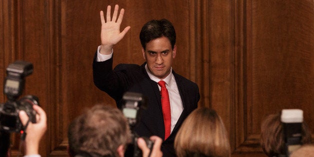 Britain's Labour Party leader Ed Miliband waves as he leaves after delivering his resignation at a press conference in Westminster, London, Friday, May 8, 2015. The Conservative Party surged to a seemingly commanding lead in Britain's parliamentary General Election, with Prime Minister David Cameron remaining in 10 Downing Street.(AP Photo/Tim Ireland)