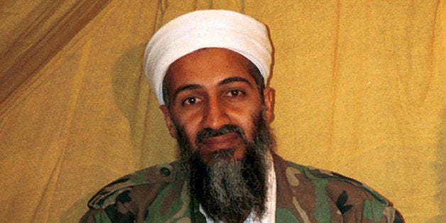 FILE - This undated file photo shows al Qaida leader Osama bin Laden in Afghanistan. A new book due out Tuesday, Oct. 16, 2012 says President Barack Obama hoped to put Bin Laden on trial if he had surrendered during a U.S. raid. Author Mark Bowden quotes the president as saying he thought he could make a strong political argument for giving bin Laden the full rights of a criminal defendant, to show U.S. justice applies even to him. In "The Finish," Bowden writes, however, that Obama said he expected the terror leader to go down fighting. (AP Photo)