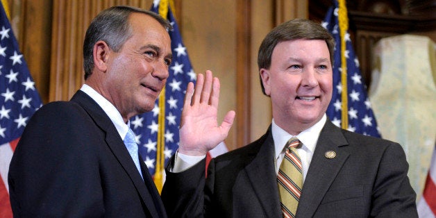 House Speaker John Boehner of Ohio reenacts the swearing in of Rep. Mike Rogers, R-Ala., Wednesday, Jan. 5, 2011, on Capitol Hill in Washington. (AP Photo/Susan Walsh)