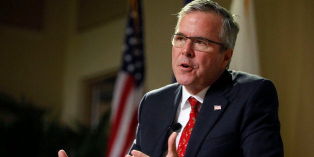 Former Florida Gov. Jeb Bush speaks during an event at the Metropolitan University in San Juan, Puerto Rico, Tuesday, April 28, 2015. The former Florida governor delivered a speech on economic opportunities partly in Spanish on Tuesday, and his audience responded with hearty applause. Bush is fluent in the language, and often uses it in Florida, but it's rarely heard in Republican presidential campaign politics. (AP Photo/Ricardo Arduengo)