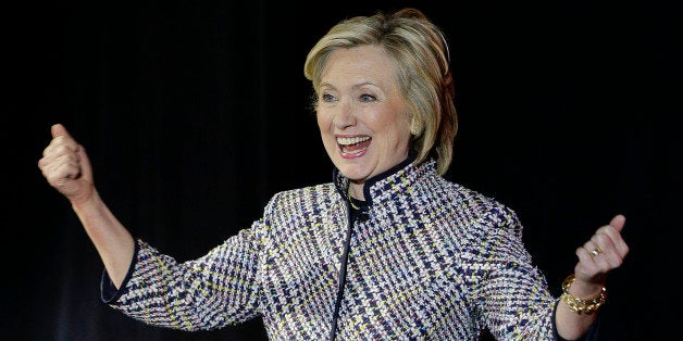 Hillary Rodham Clinton reacts to applause from the crowd before speaking during the sixth annual Women in the World Summit, Thursday, April 23, 2015, in New York. (AP Photo/Julie Jacobson)