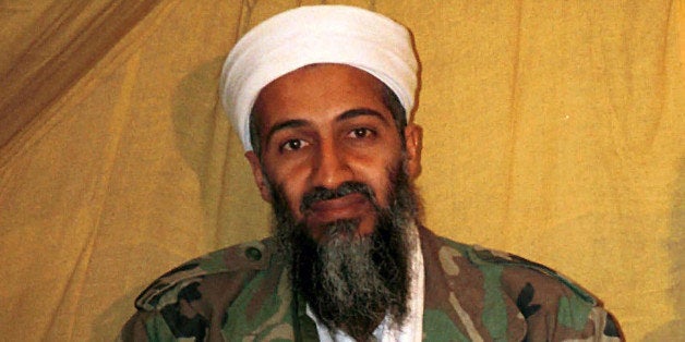 FILE - This undated file photo shows al Qaida leader Osama bin Laden in Afghanistan. A new book due out Tuesday, Oct. 16, 2012 says President Barack Obama hoped to put Bin Laden on trial if he had surrendered during a U.S. raid. Author Mark Bowden quotes the president as saying he thought he could make a strong political argument for giving bin Laden the full rights of a criminal defendant, to show U.S. justice applies even to him. In "The Finish," Bowden writes, however, that Obama said he expected the terror leader to go down fighting. (AP Photo)