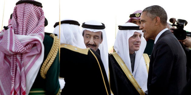 FILE - In this Tuesday, Jan. 27, 2015 file photo, President Barack Obama is greeted by new Saudi King Salman bin Abdul Aziz as the president and first lady Michelle Obama arrive on Air Force One at King Khalid International Airport, in Riyadh, Saudi Arabia. It is not just the Saudi king who will be skipping the Camp David summit of U.S. and allied Arab leaders. Most Gulf heads of state won't be there. The absences will put a damper on talks that are designed to reassure key Arab allies, and almost certainly reflect dissatisfaction among leaders of the six-member Gulf Cooperation Council with Washington's handling of Iran and what they expect to get out of the meeting. (AP Photo/Carolyn Kaster, File)