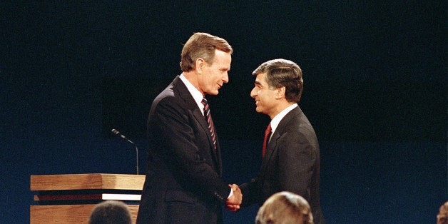 Democratic candidate and Massachusetts Gov. Michael Dukakis shakes hands with Vice President and Republican candidate George Bush, left, prior to their second and final debate at Pauley Pavillion on UCLA campus, in Los Angeles, Calif., on October 13, 1988. (AP Photo/Lennox McLendon)