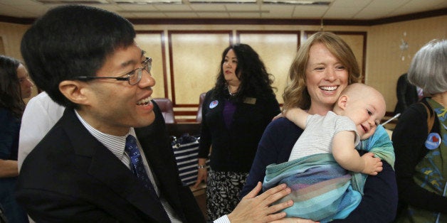 Sen Richard Pan, D-Sacramento, left, talks with Jennifer Wonnacott, a supporter of Pan's measure requiring California schoolc