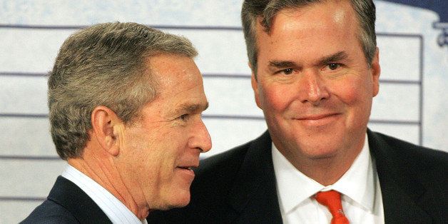 President Bush, left, spends a moment with his brother and Florida Gov. Jeb Bush, prior to the President's speech on Social Security at the Pensacola Junior College, Friday, March 18, 2005, in Pensacola, Fla. (AP Photo/Phil Coale)
