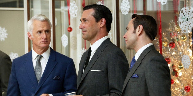 This publicity image released by AMC shows John Slattery as Roger Sterling, left, Jon Hamm as Don Draper, center, and Vincent Kartheiser as Pete Campbell in a scene from the season six premiere of "Mad Men," airing Sunday, April 7, on AMC. (AP Photo/AMC, Michael Yarish)