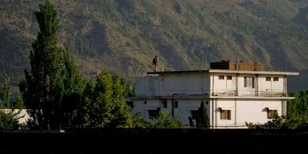 FILE - In this May 6, 2011 file photo, a Pakistan army soldier stands on top of the house where it is believed al-Qaida leader Osama bin Laden lived in Abbottabad, Pakistan. After an extraordinary week of events in the United States and abroad, one thing is clear: Osama bin Laden's death at the hands of American forces has the potential to ripple out into global affairs in countless ways _ political and military, diplomatic and cultural, and of course national security in the United States. (AP Photo/Anjum Naveed, File)