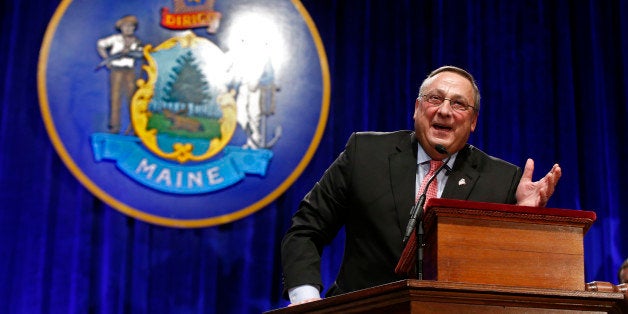 Republican Gov. Paul LePage returns to the podium after delivering his inauguration address to joke about how he noticed many of the legislators are now sporting facial hair, Wednesday, Jan. 7, 2015, at the Augusta Civic Center in Augusta, Maine. (AP Photo/Robert F. Bukaty)