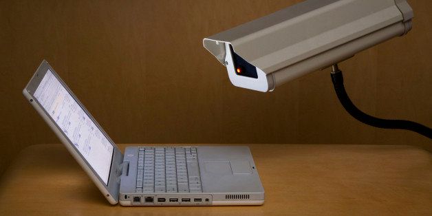 Surveillance camera peering into laptop computer