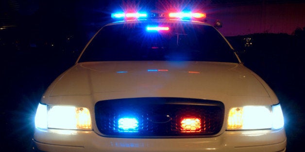 Long exposure to capture the full array of police car lights. 12MP