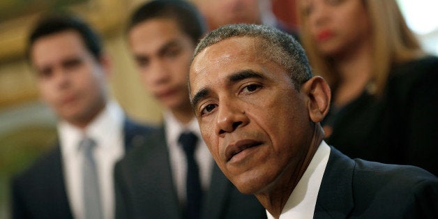 WASHINGTON, DC - MAY 19: U.S. President Barack Obama delivers brief remarks before signing the National Blue Alert Act of 2015 with family members of New York Police Department Detectives Rafael Ramos and Wenjian Liu in the Oval Office of the White House May 19, 2015 in Washington, DC. The newly signed legislation requires the Department of Justice to establish a national Blue Alert communications network to disseminate information on the serious injury or death of a law enforcement officer in the line of duty, an officer who is missing in connection with the officer's official duties, or an imminent and credible threat that an individual intends to cause the serious injury or death of a law enforcement officer. (Photo by Win McNamee/Getty Images)