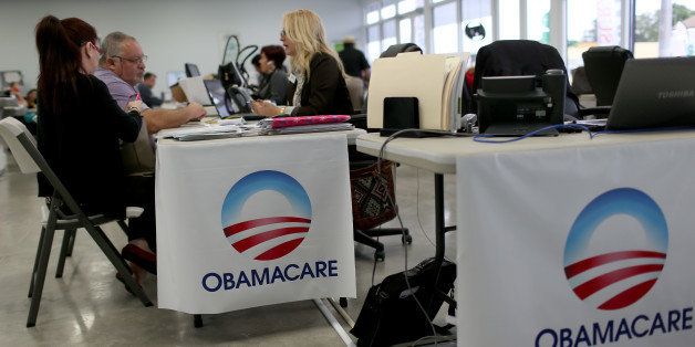 MIAMI, FL - FEBRUARY 05: Aymara Marchante (L) and Wiktor Garcia sit with Maria Elena Santa Coloma, an insurance advisor with UniVista Insurance company, as they sign up for the Affordable Care Act, also known as Obamacare, before the February 15th deadline on February 5, 2015 in Miami, Florida. Numbers released by the government show that the Miami-Fort Lauderdale-West Palm Beach metropolitan area has signed up 637,514 consumers so far since open enrollment began on Nov. 15, which is more than twice as many as the next large metropolitan area, Atlanta, Georgia. (Photo by Joe Raedle/Getty Images)