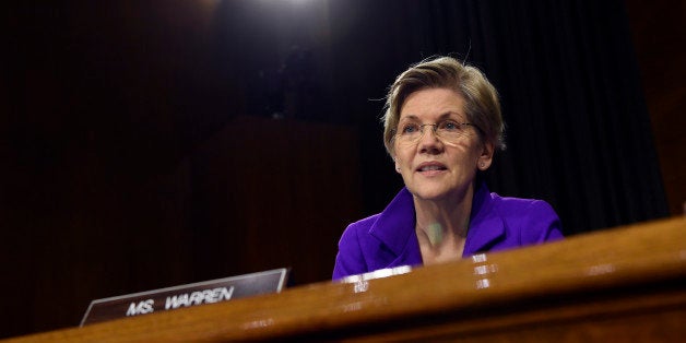 Senate Banking Committee member Sen. Elizabeth Warren, D-Mass., listens to testimony on Capitol Hill in Washington, Tuesday, Feb. 24, 2015, from Federal Reserve Board Chair Janet Yellen. Yellen said Tuesday that the U.S. economy is making steady progress, but the Fed remains patient in raising interest rates because too many Americans are still unemployed, wage growth remains sluggish and inflation is too low. (AP Photo/Susan Walsh)