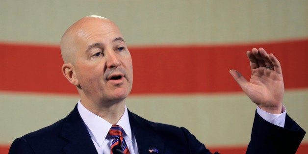 Neb. Gov. Pete Ricketts gestures during a news conference in Lincoln, Neb., Wednesday, May 20, 2015. Gov. Ricketts voiced his opposition to a bill to abolish the death penalty which is up for a final vote before the Legislature on Wednesday, and promised to veto the bill should it pass. (AP Photo/Nati Harnik)