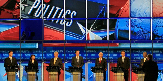 Former Pennsylvania Sen. Rick Santorum, left to right, Rep. Michele Bachmann, R-Minn., former House Speaker Newt Gingrich, former Massachusetts Gov. Mitt Romney, Rep. Ron Paul, R-Texas, former Minnesota Gov. Tim Pawlenty and businessman Herman Cain during the first New Hampshire Republican presidential debate at St. Anselm College in Manchester, NH., Monday night, June 13, 2011. Debate Moderator, CNN's John King, stands facing the group at right. (AP Photo/Jim Cole)