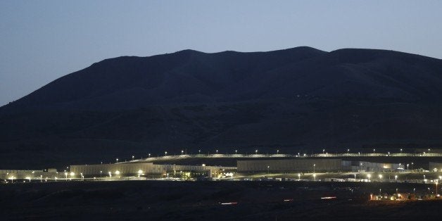 This Monday, June 10, 2013 photo shows a ground level view of Utah's NSA Data Center in Bluffdale, Utah. The nation's new billion-dollar epicenter for fighting global cyberthreats sits just south of Salt Lake City, tucked away on a National Guard base at the foot of snow-capped mountains. The long, squat buildings span 1.5 million square feet, and are filled with super-powered computers designed to store massive amounts of information gathered secretly from phone calls and emails. (AP Photo/Rick Bowmer)