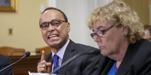 Rep. Luis Gutierrez, D-Ill., a leading advocate in the House for comprehensive immigration reform, is flanked by Rep. Robert B. Aderholt, R-Ala., left, and Rep. Zoe Lofgren, D-Calif., right, as the House Rules Committee hears from Democrats opposed to a plan by House Republicans aimed at countering President Barack Obama's executive actions on immigration, at the Capitol in Washington, Monday, Jan. 12, 2015. (AP Photo/J. Scott Applewhite)