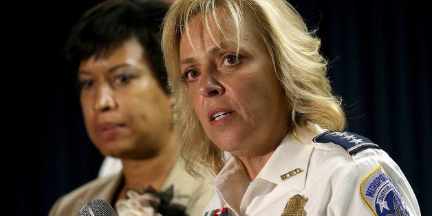 WASHINGTON, DC - MAY 21: Mayor Muriel Bowser (L) of Washington, DC listens as Chief of the Metropolitan Police Department Cat