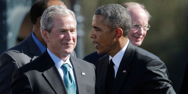 President Barack Obama shakes hands with Former President George W. Bush after Obama spoke to a large crowd near the Edmund Pettus Bridge, Saturday, March 7, 2015, in Selma, Ala. This weekend marks the 50th anniversary of "Bloody Sunday,' a civil rights march in which protestors were beaten, trampled and tear-gassed by police at the Edmund Pettus Bridge, in Selma. (AP Photo/Gerald Herbert)