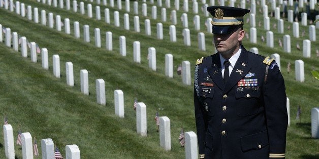 ARLINGTON, VA - MAY 25: A member of the honor guard stands as the motorcade carrying U.S. President Barack Obama arrives fo