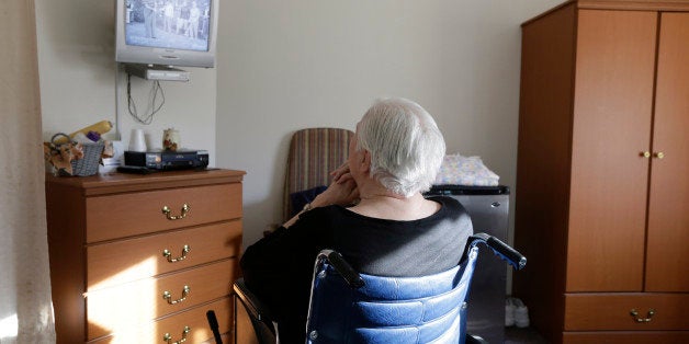 FILE - In this Tuesday, Jan. 8, 2013, file photo, an elderly woman who has suffered abuse by a relative watches "I Love Lucy" on a television inside her room at Cedar Village retirement community in Mason, Ohio. The Shalom Center, that is a part of the community, offers shelter, along with medical, psychological and legal help, to elderly abuse victims in this northern Cincinnati suburb. Eight such shelters have formed an alliance and are scheduled to meet to share best practices and hear from experts on elder abuse. (AP Photo/Al Behrman, File)