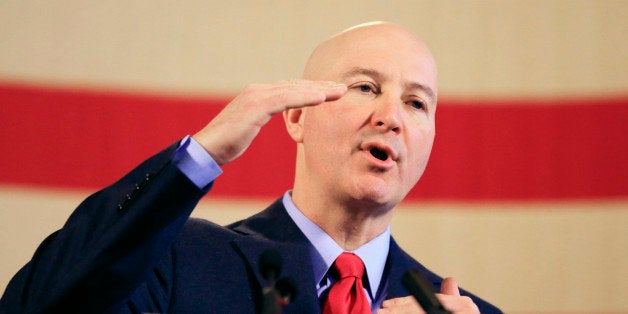 Nebraska Gov. Pete Ricketts speaks at a news conference after delivering his first State of the State address to lawmakers, Thursday, Jan. 22, 2015, in Lincoln, Neb. (AP Photo/Nati Harnik)