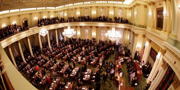 California Gov. Jerry Brown and his wife Anne Gust Brown, are greeted by lawmakers before his inauguration at the state Capitol Monday, Jan. 5, 2015, in Sacramento, Calif. When Brown takes the oath of office Monday, it will be the first time a California governor will be sworn in to a fourth term. The 76-year-old Democrat, who held office from 1975 to 1983 before term limits and returned for a third term in 2011, delivered a joint inauguration and state of the state address in the Assembly chamber at the state Capitol. (AP Photo/Eric Risberg)