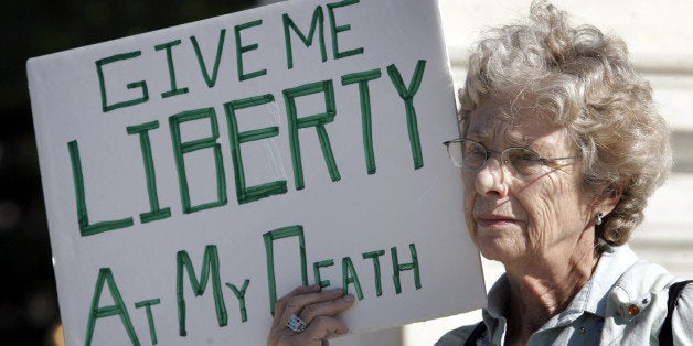 Ruth Gallaid from Eugene, Or., who supports physician assisted suicide, protests in front of the Supreme Court Wednesday, Oct. 5, 2005, in Washington. The Supreme Court revisited the emotionally charged issue of physician-assisted suicide in a test of the federal government's power to block doctors from helping terminally ill patients and end their lives. (AP Photo/Charles Dharapak)